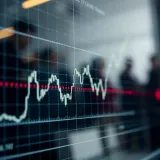Graph showing currency exchange rate fluctuations with upward trend lines
